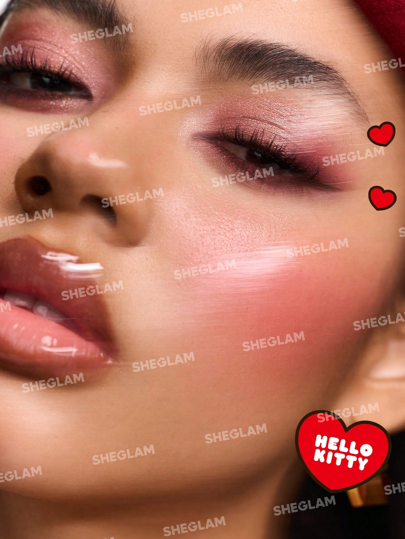 Close-up of a person's face with makeup, featuring the brand 'SHEGLAM' and a 'Hello Kitty' logo.