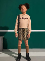 تنورة بناتي من شي إن بنقشة جلد الثعبان وأزرار وهمية  