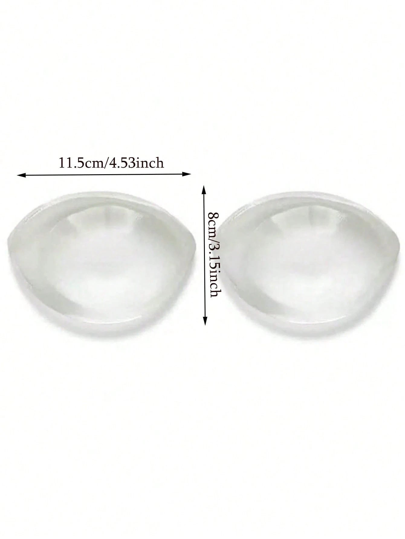 Two white silicone breast forms with measurements on a white background