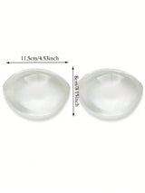 Two white silicone breast forms with measurements on a white background