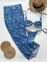Blue tie-dye swimsuit with a hat and coasters on a white background