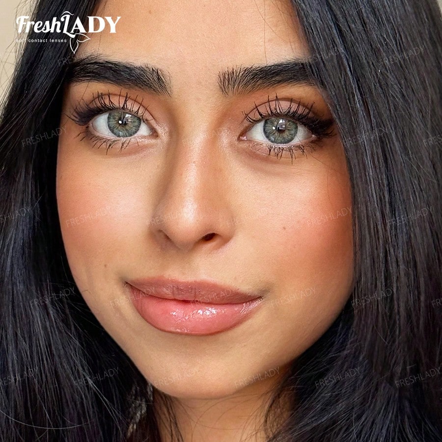 Close-up of a woman's face showcasing false eyelashes, with the FreshLADY brand logo visible in the top left corner.
