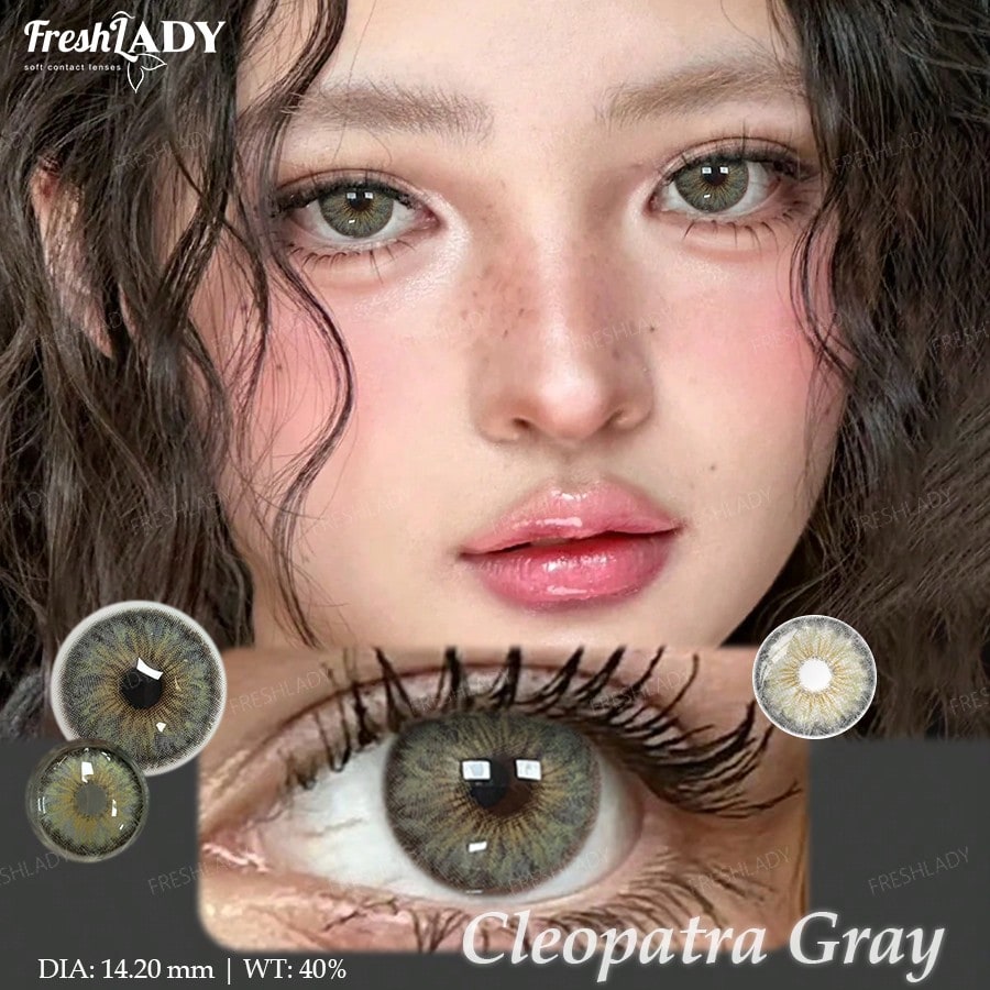 A close-up beauty graphic showing a model's face and an enlarged eye wearing a gray-green contact lens. The image includes inset circular lens views, the text 'FreshLADY', 'Cleopatra Gray', and size/weight details.