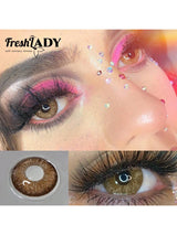 Close-up of eyes with makeup and contact lens display, featuring 'FreshLADY' brand.