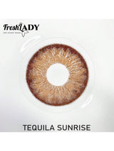 Brown contact lens in a clear case with 'FreshLADY' branding on a white background