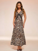 Woman wearing a leopard print dress against a beige background