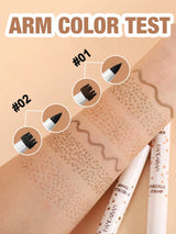 An arm color test graphic showing a forearm with two brown makeup swatches labeled #01 and #02, plus zoomed-in circular insets of the applicators. Large text at the top reads 'ARM COLOR TEST,' and two cosmetic pencils are visible at the bottom on a beige background.