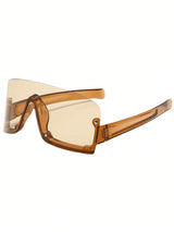 Brown sunglasses with a clear lens on a white background