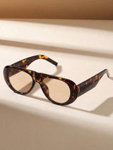 Tortoiseshell sunglasses on a beige background