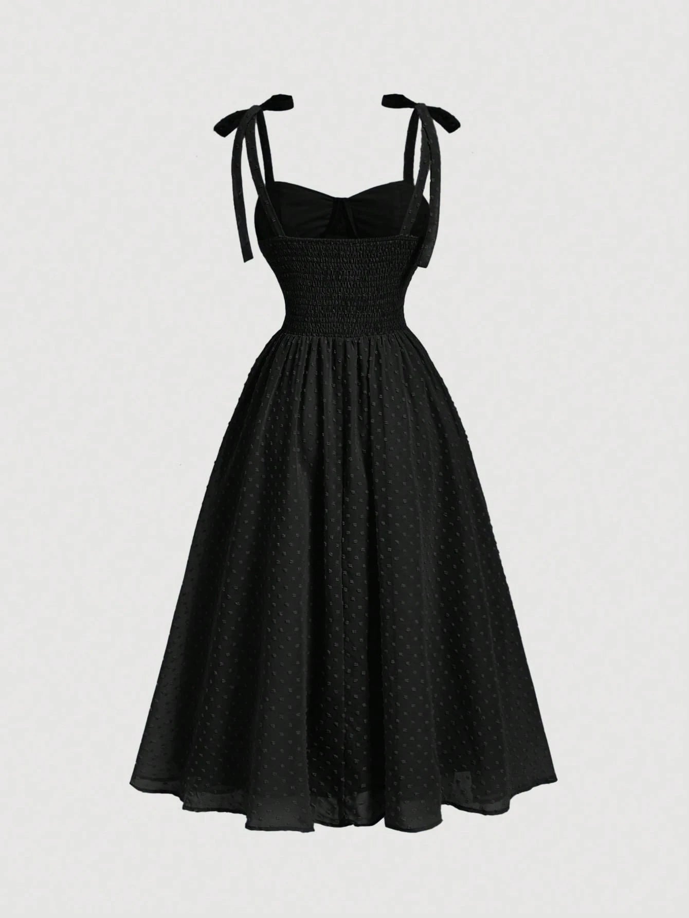 Black dress with bow straps on a white background