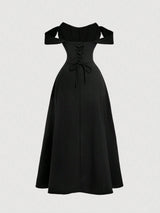 Black off-shoulder dress on a light gray background