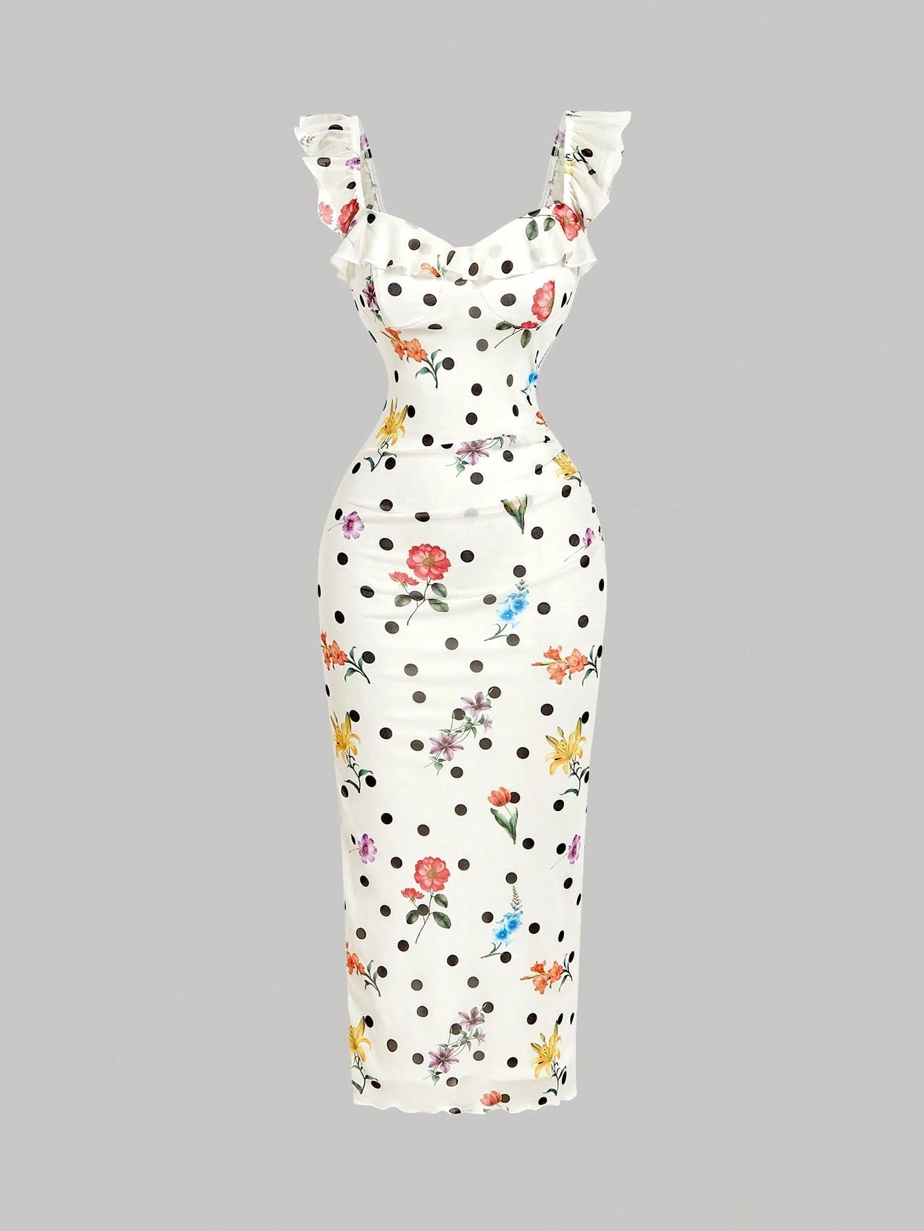 White dress with black polka dots and colorful floral pattern on a gray background