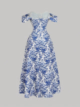 Blue and white floral dress on a gray background