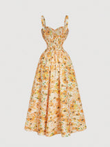 Floral dress with a yellow and green pattern on a light gray background