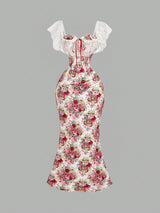 Floral dress with white lace sleeves on a gray background