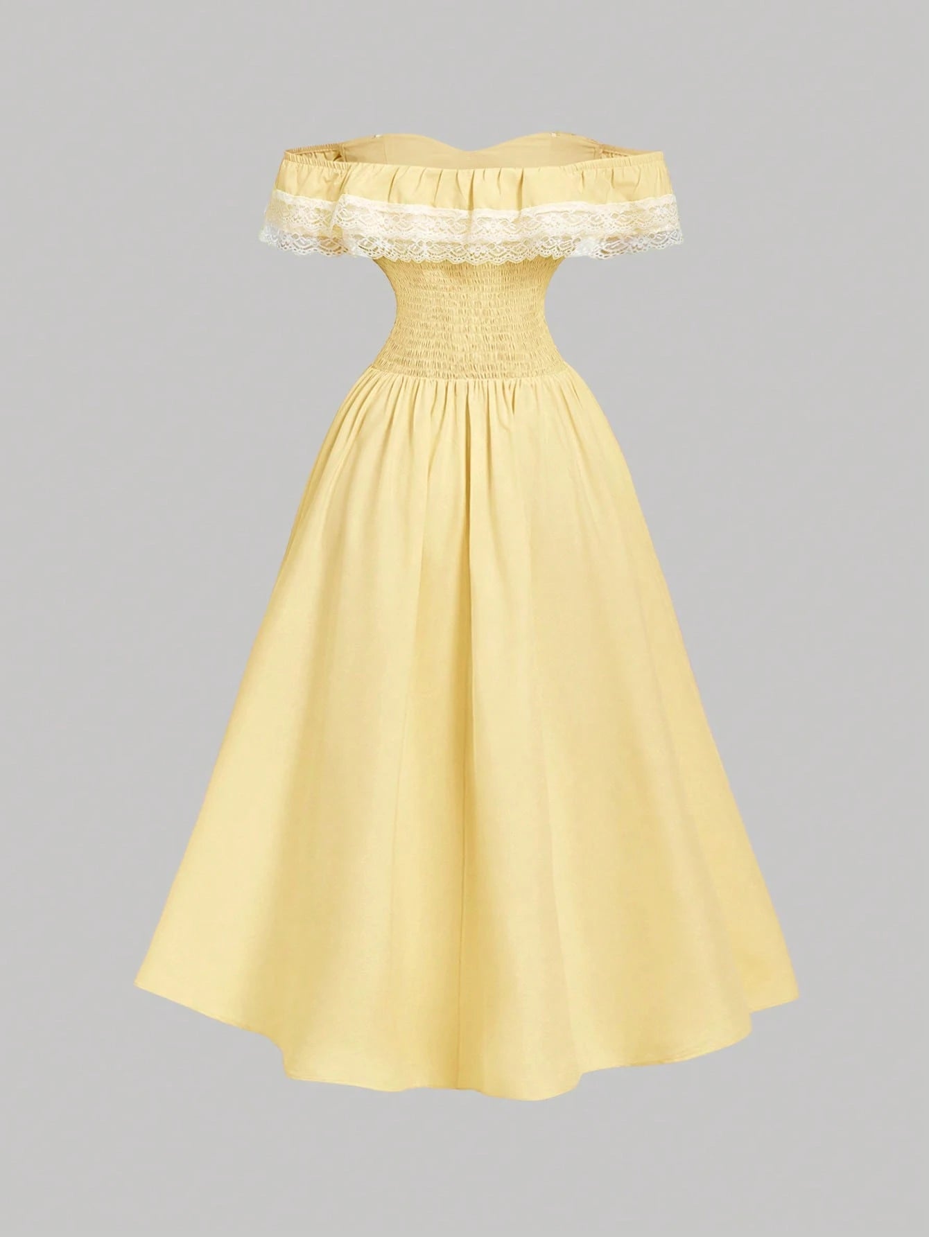 Yellow off-shoulder dress with lace details on a gray background