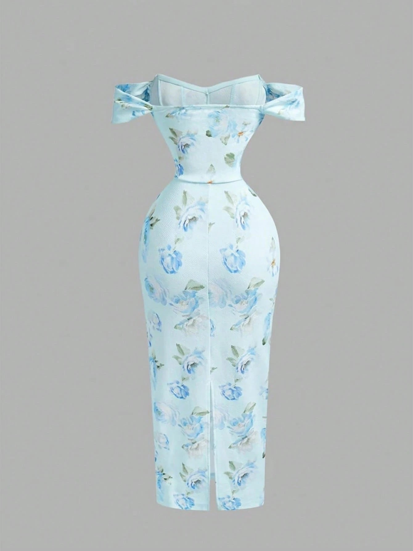 Light blue floral dress with bow straps on a gray background