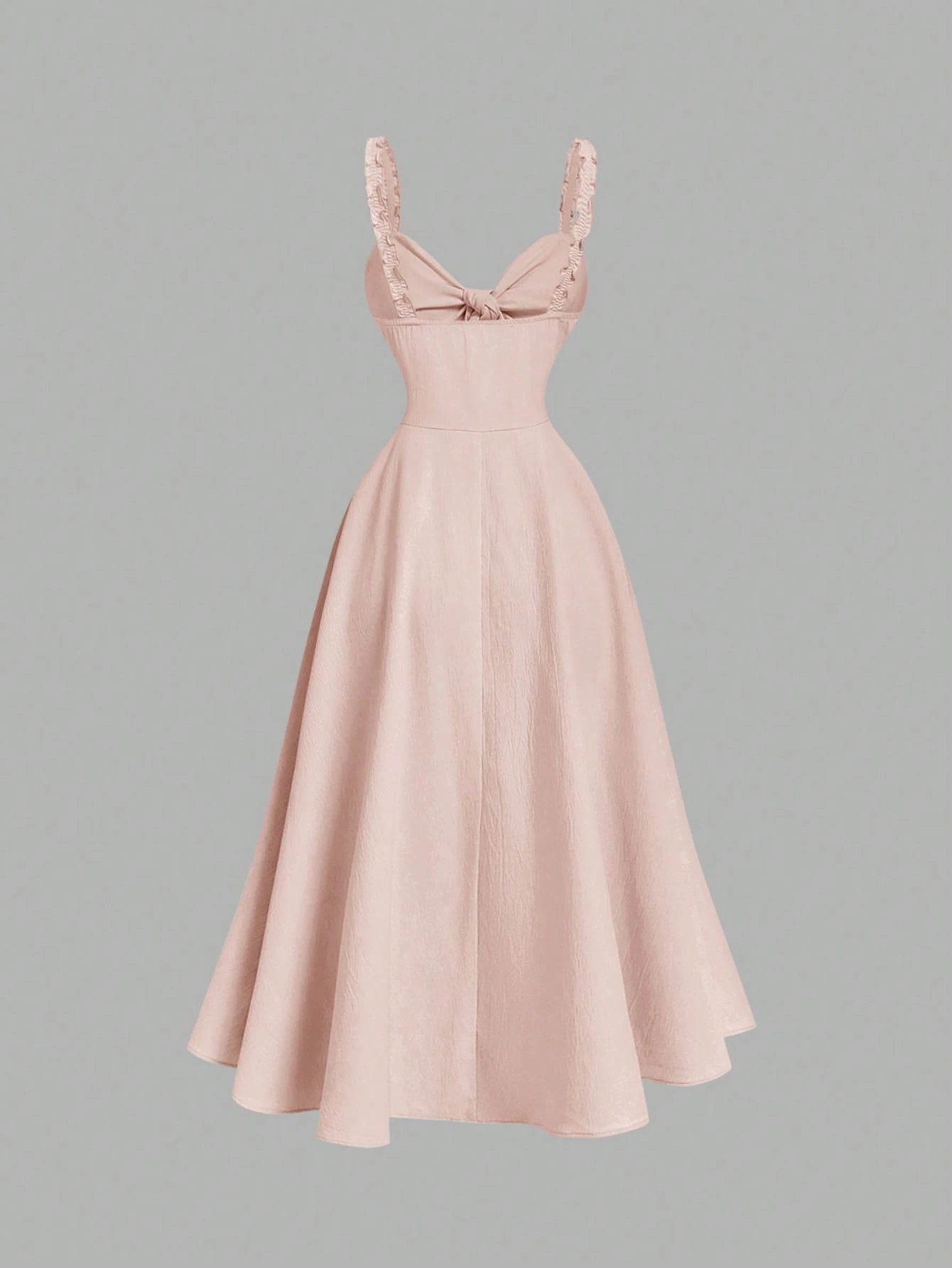Pink dress with a bow detail on a gray background