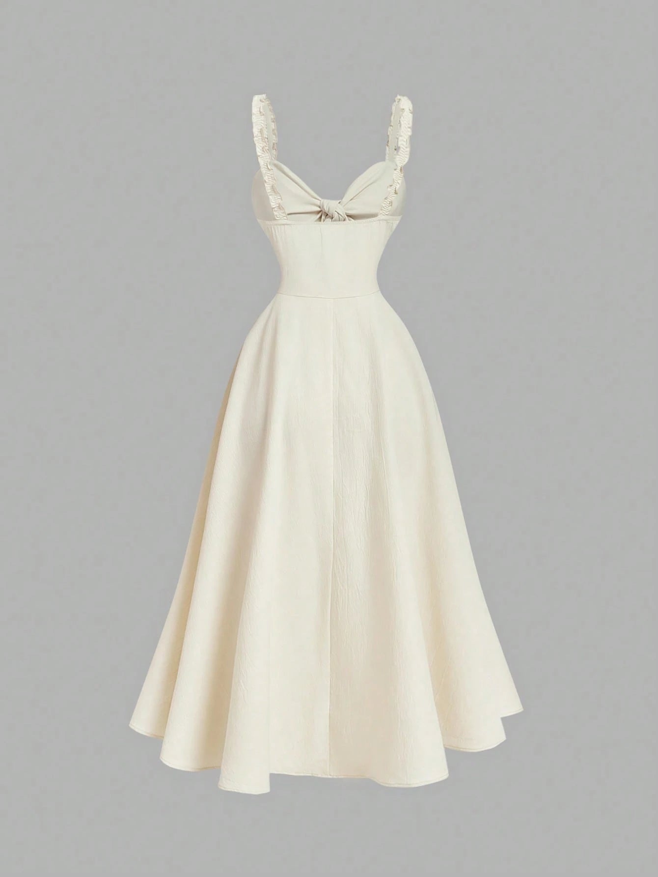 White dress with lace straps on a gray background