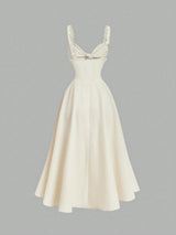 White dress with lace straps on a gray background
