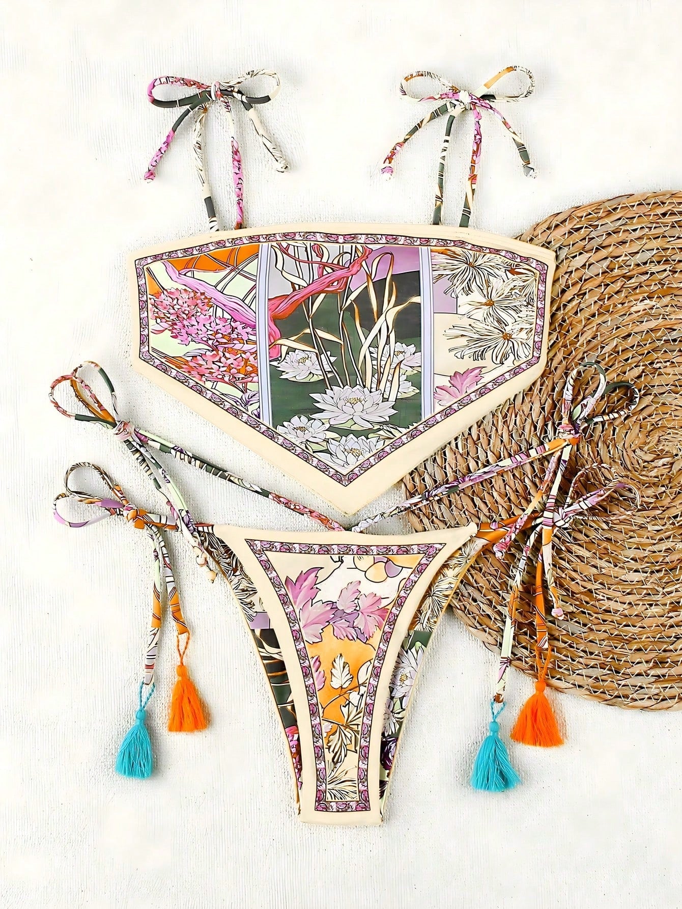 Floral bikini set with tassels on a white background