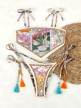 Floral bikini set with tassels on a white background