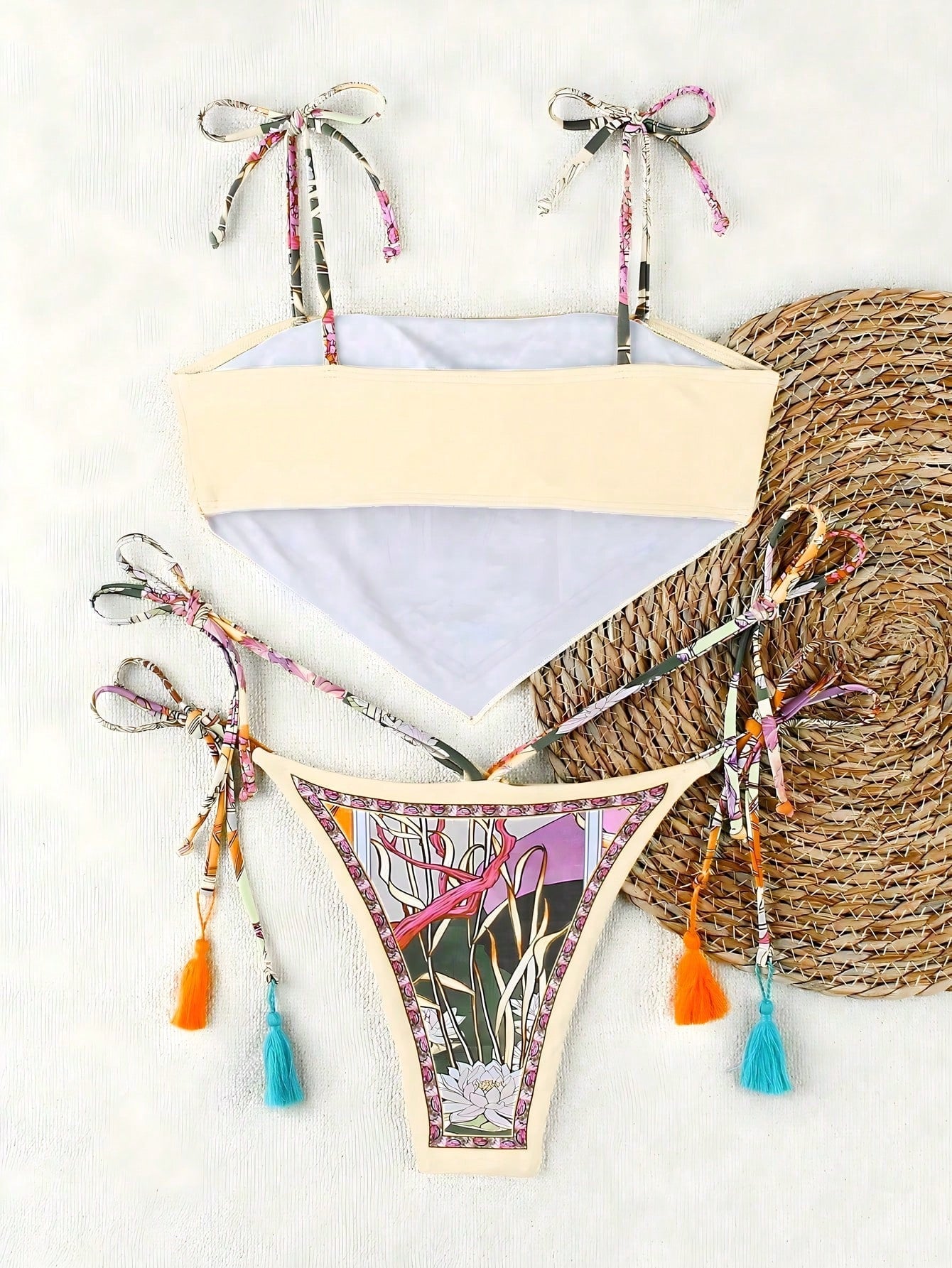 Colorful bikini set with floral design on a white background
