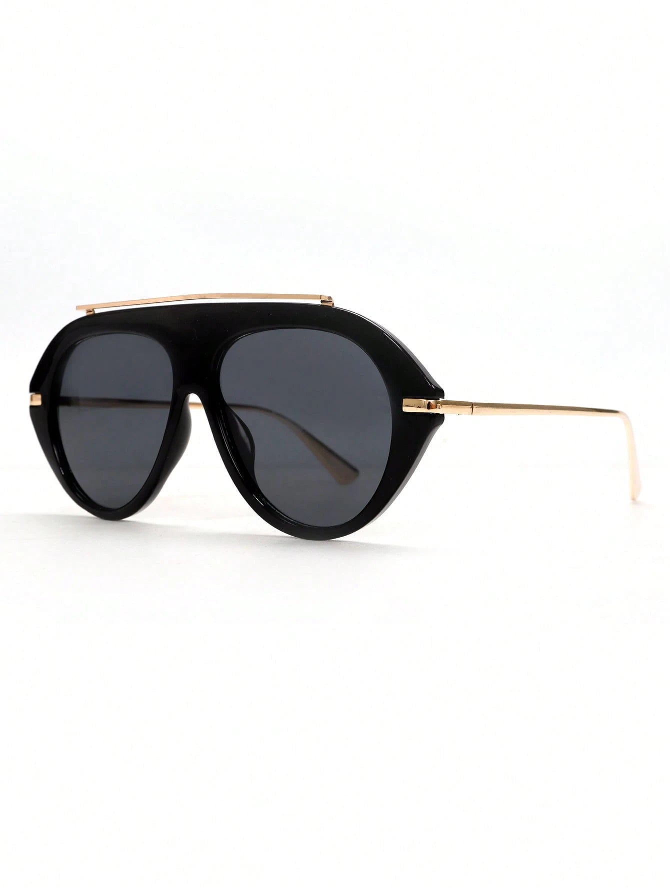 Black sunglasses with gold frame on a white background