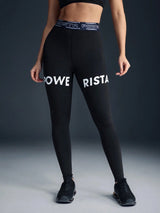 Person wearing black leggings with 'RISTA' branding on a gray background