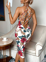 Woman wearing a floral dress with an open back in a living room setting