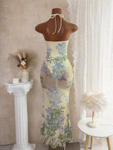 Floral dress on a mannequin against a neutral background