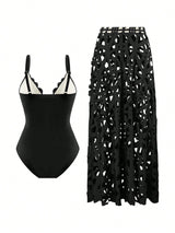 Black swimsuit and black patterned skirt on a white background
