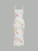 A white spaghetti-strap midi dress with a colorful pastel floral print, shown against a solid gray background.