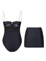 Black swimsuit with a strapless top and skirt on a white background