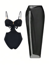 Black bikini set with sheer black skirt on a white background