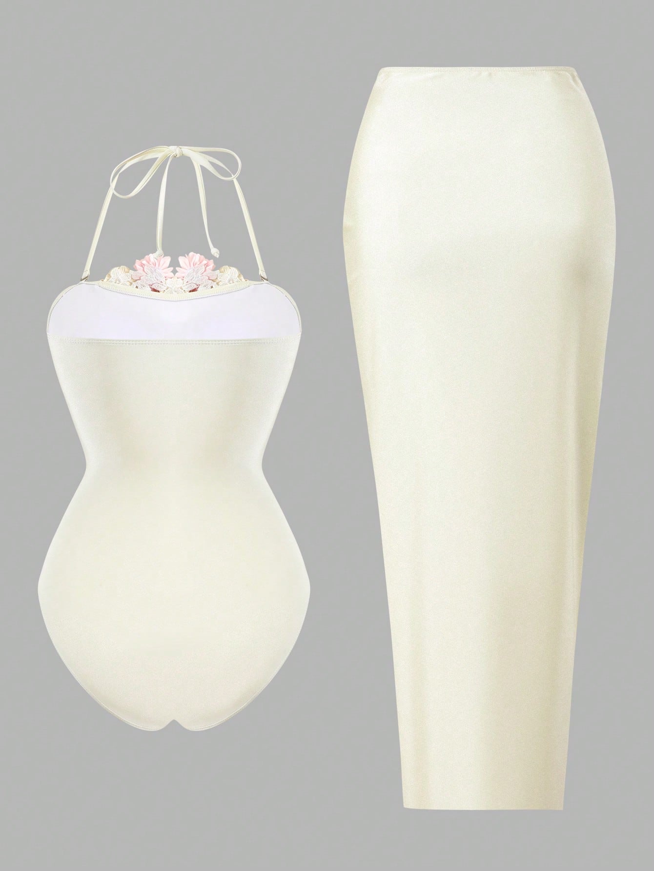 White dress form with floral arrangement on a gray background