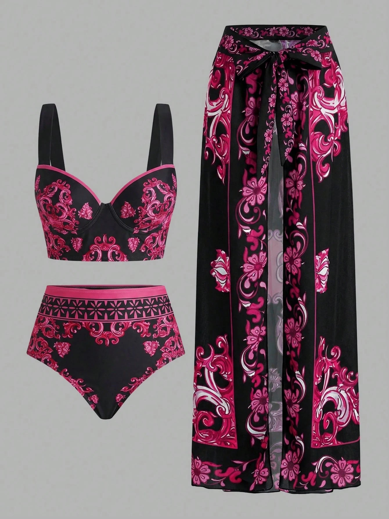 Black and pink patterned bikini set with matching pants on a gray background