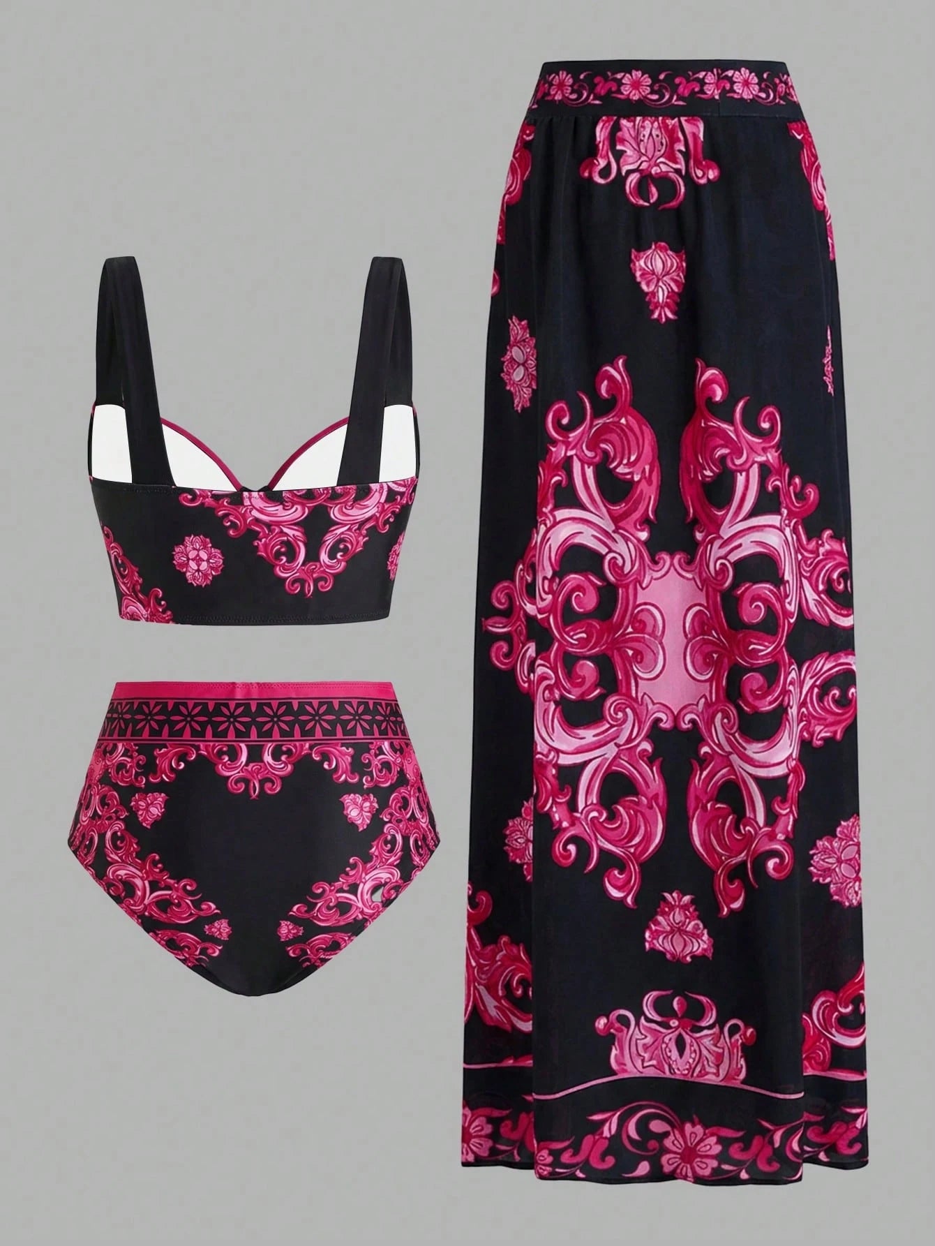 Black and pink patterned bikini set with matching pants on a gray background