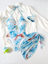 Multicolored swimsuit with a white cover-up on a white background