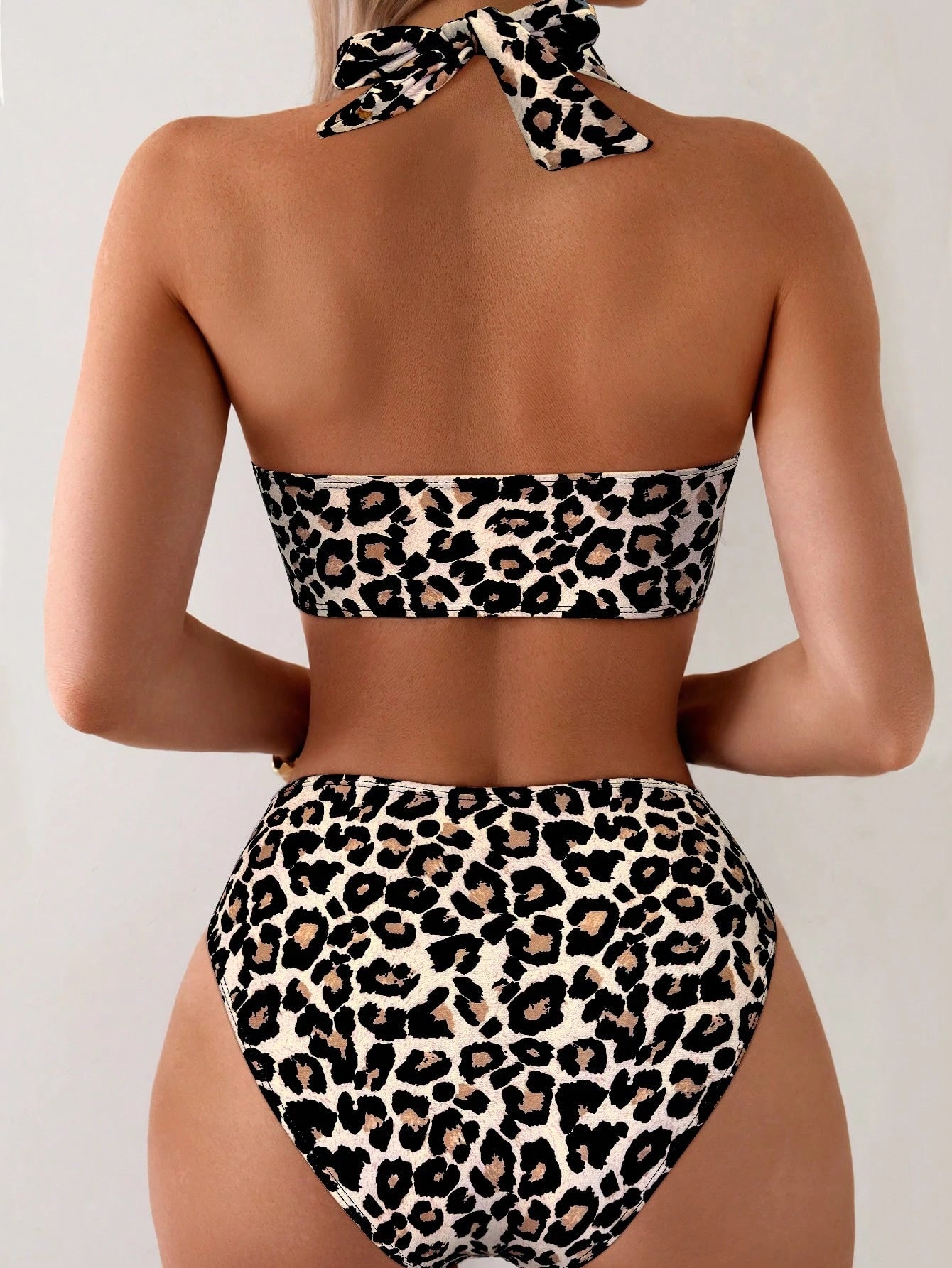 Leopard print bikini set on a plain background