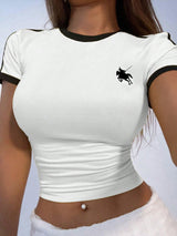 White crop top with black accents and a logo on a plain background